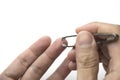 Pulling of splinter from finger by using tweezers or tong. Royalty Free Stock Photo